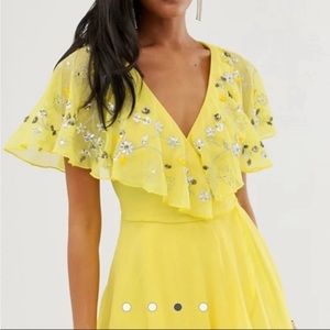ASOS yellow dress with wrap tie waist & side zipper. Deep V plunge w rhinestone